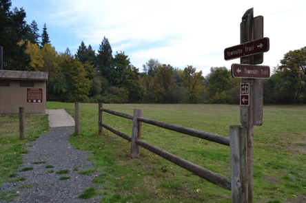 Accessible vault toilets at boat ramp and group camping – compact gravel to concrete walkway – Townsite Trail sign